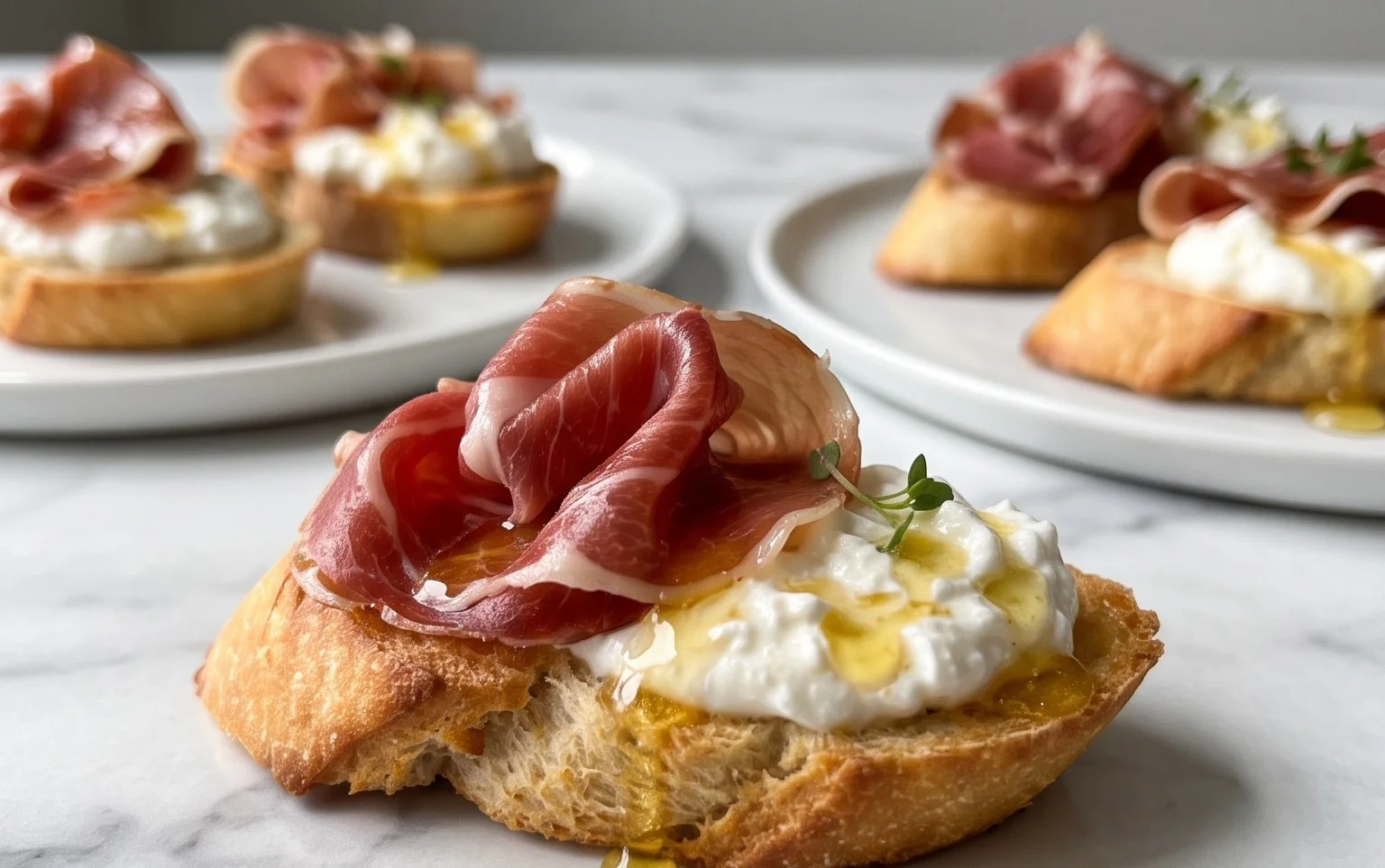 Beef Prosciutto Crostini with Burrata and Lemon Honey Drizzle